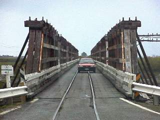 only one car at a time, watch out for trains!