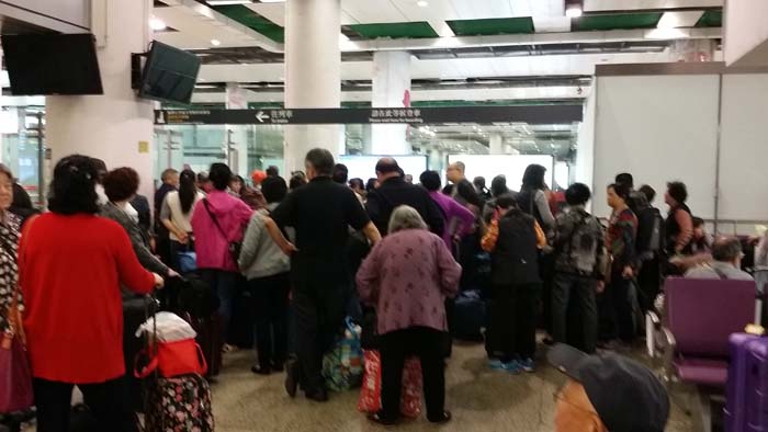 Waiting to board the train in Hong Kong.