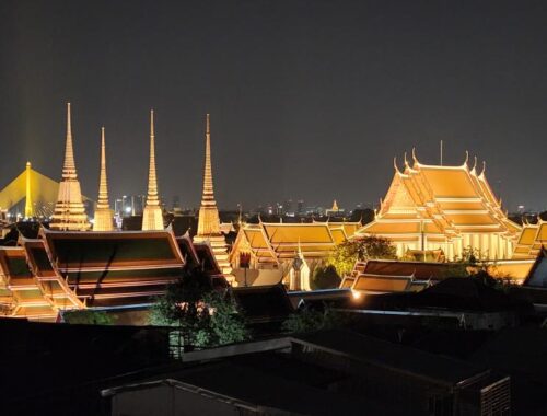 View of Bangkok skyline over Wat Po at night