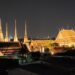 View of Bangkok skyline over Wat Po at night