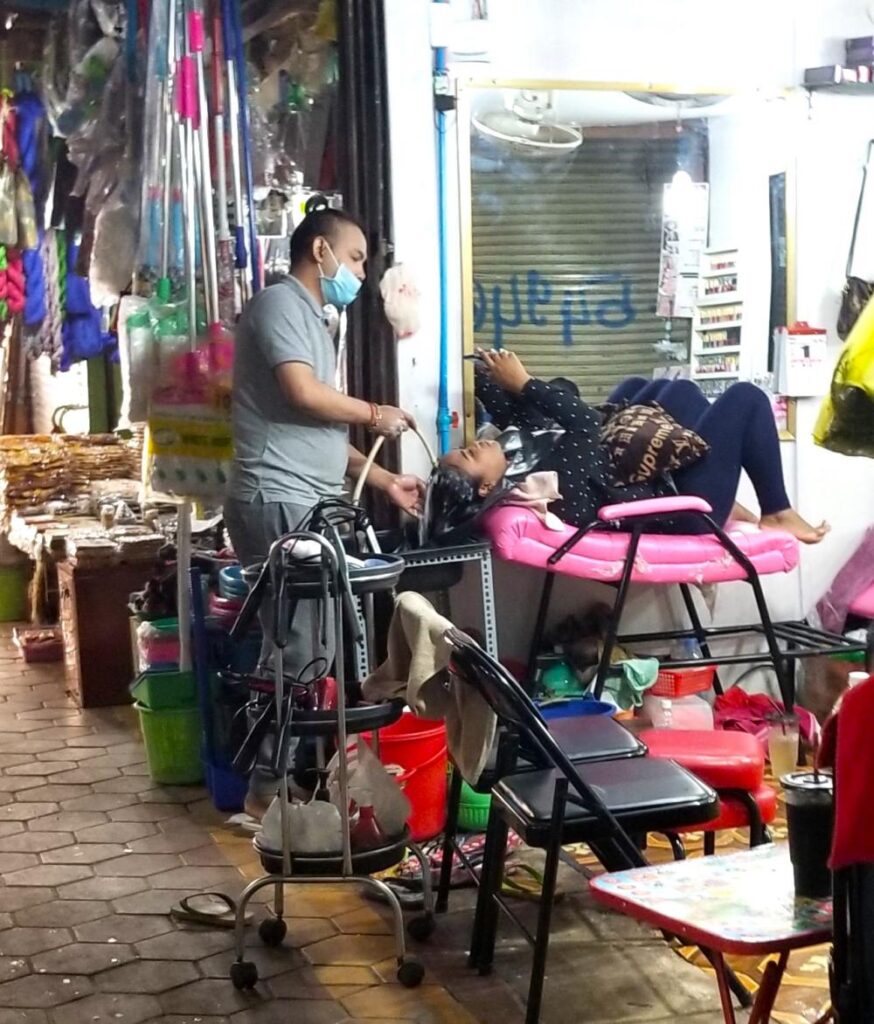 Hair washing in the old market Siem Reap